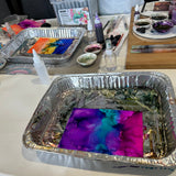 Alcohol ink painting workshop exploring colour flow, movement and abstract designs in a guided, relaxed setting.